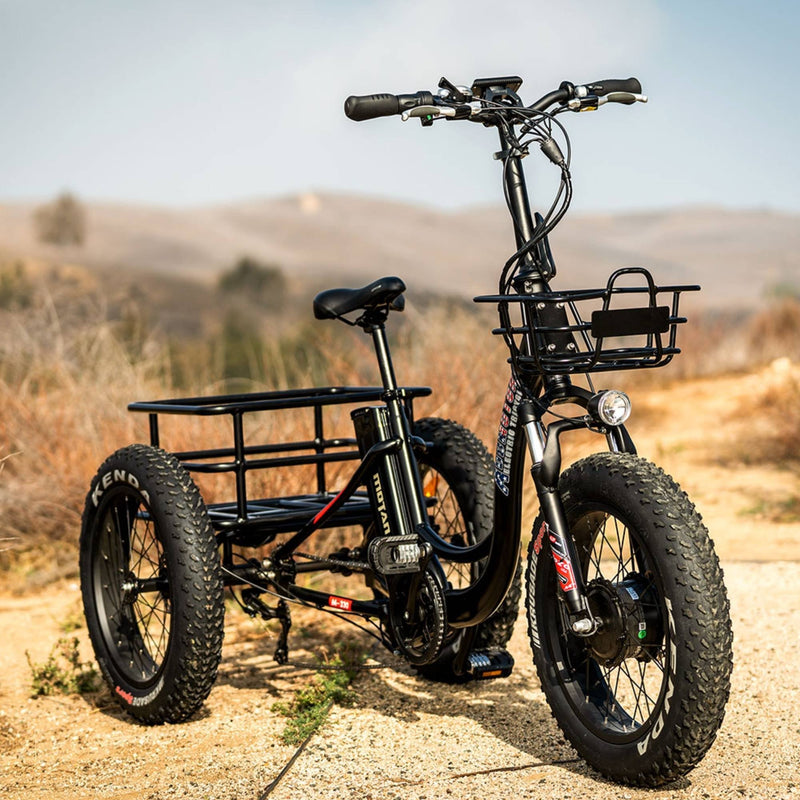 AddMotor 750W MOTAN M-330 P7 20" Step-Thru Fat Trike parked on dirt road